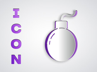 Paper cut Bomb ready to explode icon isolated on grey background. Paper art style. Vector Illustration