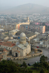Fototapeta na wymiar Panorama of Gori town and view at The mother of God Cathedral. Gori, Georgia, Caucasus.