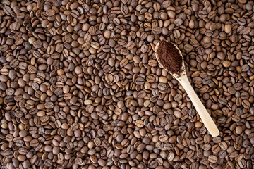 coffee beans on wooden spoon