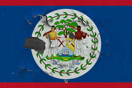 Belize flag close up old, damaged and dirty on wall peeling off paint to see inside surface. Vintage National Concept.