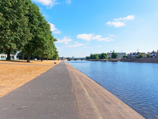 Long straight footpath at the side of the River Trent along Victoria Embankment, Nottingham towards Trent Bridge