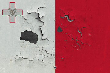 Malta flag close up old, damaged and dirty on wall peeling off paint to see inside surface. Vintage National Concept.