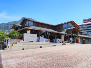 MONTREUX, SWITZERLAND on JULY 2017: Market hall building in european city in canton Vaud, clear blue sky in warm sunny summer day.