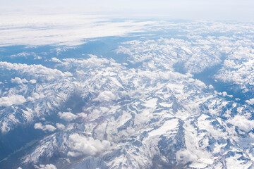 Fototapeta na wymiar Aerial view from airplane window - Alps