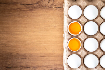 yellow broken egg. Broken eggs in the container. village eggs. delicious eggs for the kitchen. delicious breakfast with morning breakfast.