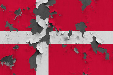 Denmark flag close up painted, damaged and dirty on wall peeling off paint to see concrete surface. Vintage National Concept.