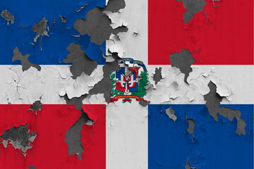 Dominican Republic flag close up painted, damaged and dirty on wall peeling off paint to see concrete surface. Vintage National Concept.