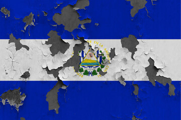 El Salvador flag close up painted, damaged and dirty on wall peeling off paint to see concrete surface. Vintage National Concept.