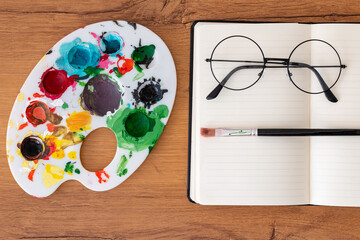painting easter eggs on wooden table