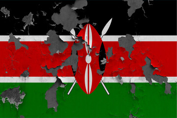 Kenya flag close up painted, damaged and dirty on wall peeling off paint to see concrete surface. Vintage National Concept.