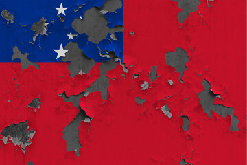Samoa flag close up painted, damaged and dirty on wall peeling off paint to see concrete surface. Vintage National Concept.