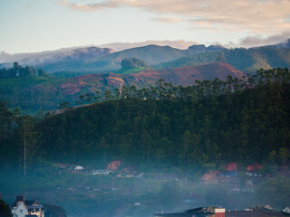 Fototapeta premium Aerial view of the dawn and the mountains near the city of Munnar. Kerala. India.