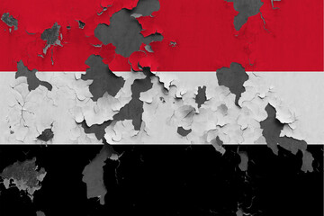 Yemen flag close up painted, damaged and dirty on wall peeling off paint to see concrete surface. Vintage National Concept.