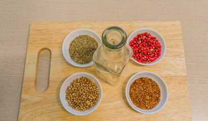 Spices in white bowl on cutting board