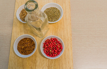 Spices in white bowl on cutting board