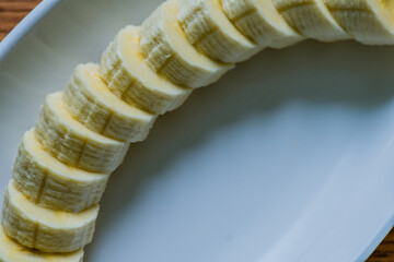 Sliced banana on white dish