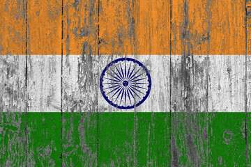 Fototapeta na wymiar India flag on grunge scratched wooden surface. National vintage background. Old wooden table scratched flag surface.
