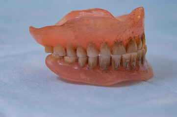 Close-up an acrylic denture prosthesis of the upper and lower jaws of a man