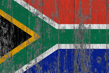South Africa flag on grunge scratched wooden surface. National vintage background. Old wooden table scratched flag surface.