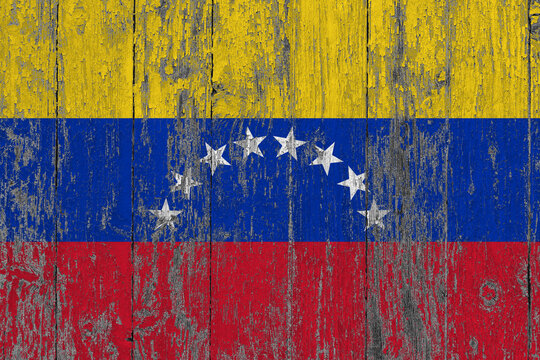 Venezuela flag on grunge scratched wooden surface. National vintage background. Old wooden table scratched flag surface. - Powered by Adobe