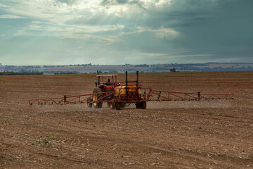 tractor spraying pesticides