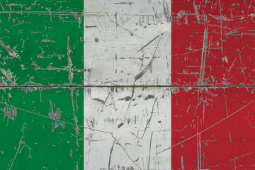 Italy flag painted on cracked dirty surface. National pattern on vintage style surface. Scratched and weathered concept.