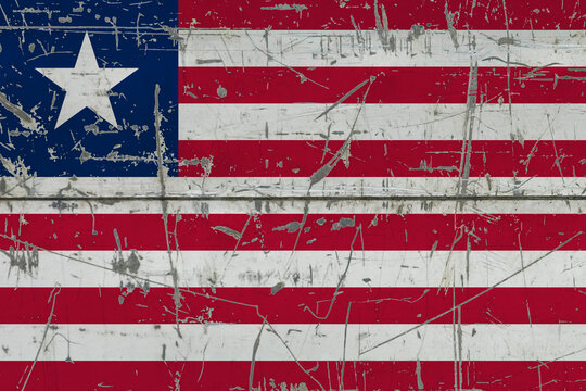 Liberia flag painted on cracked dirty surface. National pattern on vintage style surface. Scratched and weathered concept.