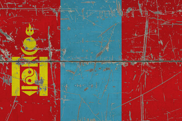 Mongolia flag painted on cracked dirty surface. National pattern on vintage style surface. Scratched and weathered concept.