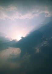 sun with clouds in the bluesky