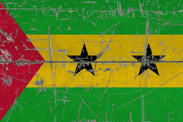 Sao Tome And Principe flag painted on cracked dirty surface. National pattern on vintage style...