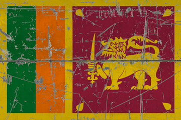 Sri Lanka flag painted on cracked dirty surface. National pattern on vintage style surface. Scratched and weathered concept.