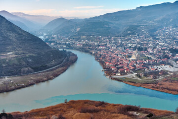Blue waters of Aragvi River joined with brown waters of Mtkvari River at the junction where the historic town of Mtskheta is located.