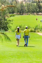 Fototapeta premium Couple walking on golf course