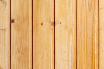 Aged yellow painted wood wall from vertical planks. Background texture