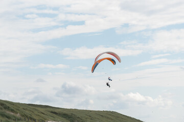 paragliding in the blue sky