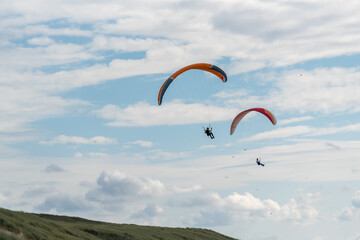 paragliding in the blue sky