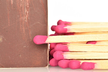 Matches made of wood, close-up, on a white background.