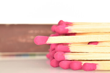 Matches made of wood, close-up, on a white background.