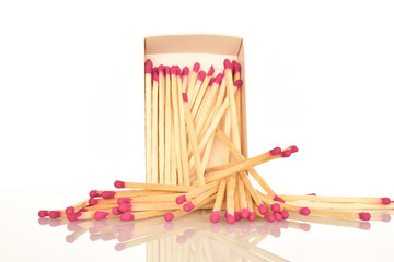 Matches made of wood, close-up, on a white background.
