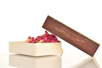 Matches made of wood, close-up, on a white background.