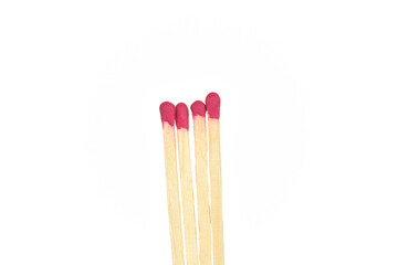 Matches made of wood, close-up, on a white background.