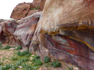 Spectacular layers of multi-coloured sandstone rock surrounding the 'lost city' of Petra in Jordan