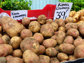 Fresh King Edward potatoes on sale at the weekly farmers' market in the rural English town of Whitchurch, Shropshire, UK