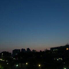 crescent moon and sunset in the city