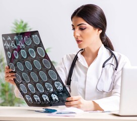 Female doctor radiologist with x-ray can image