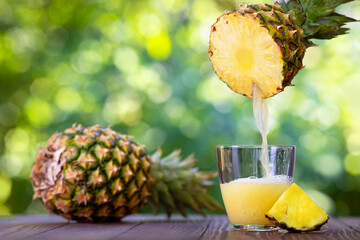 pineapple juice pouring into glass