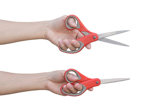 Two hand holding red scissors isolated on white background with clipping path.