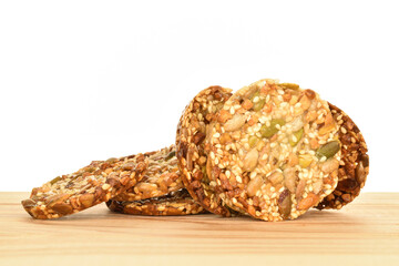 Several fresh fragrant tasty nutty cookies on a white background.