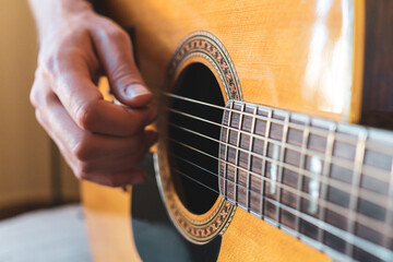 Fototapeta premium Men Playing Acoustic Guitar Closeup Photography.Vintage style.