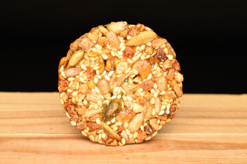 Several fresh fragrant tasty nutty cookies on a black background.
